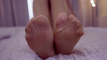 sexy blonde teases feet in nylons craving your hot load