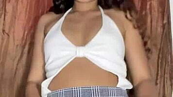 innocent petite babe lifts miniskirt to rub her sexy pussy