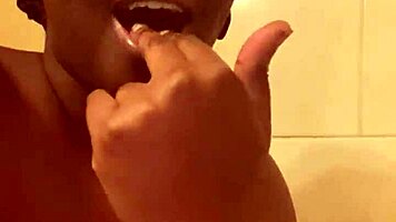 hey check out this young ebony babe showing off her wet pussy in the shower