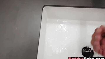 young babe gives teasing oral in steamy bathroom