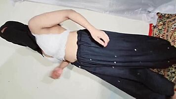 Arabic beauty in black hijab sways hips and bounces curves to exotic beats