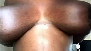 Huge boobs pregnant ebony babe teases natural tits solo.