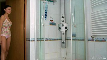Brunette teen 18+ Lucilla rubs clit under shower stream