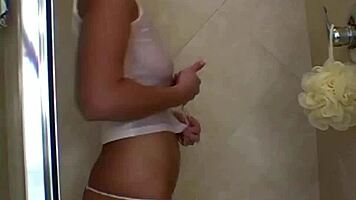 Sweet teen teases wet nipples pussy in steamy shower?