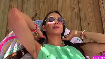 Skinny tattooed student flashes bikini outdoors for dirty tongue play