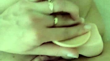 Teen brunette teases wet pussy close-up in steamy shower solo play