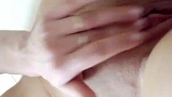 Teen brunette teases wet pussy close-up in steamy shower solo play