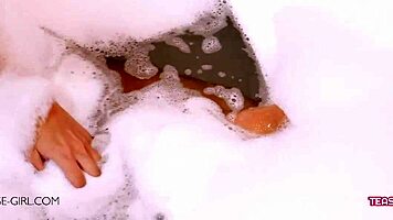 Sexy brunette teen bathes slowly revealing her perfect body curves