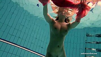 silvie dives in pool showing off her big tits and hairy pussy