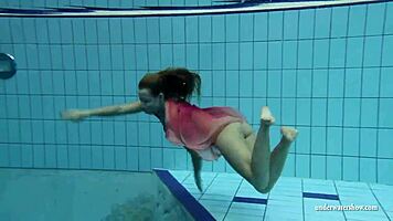 silvie dives in pool showing off her big tits and hairy pussy