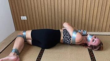 look at this redhead's sexy feet while she's ducttaped bound