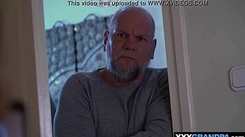 Young woman hesitates yet yields to older man's firm advance