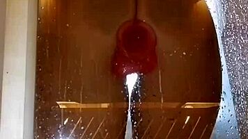 Appetizing ass girl spreads wide for pink toy fun in steamy shower.