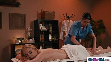 blonde babe receives steamy lesbian pussy licking massage from brunette masseuse