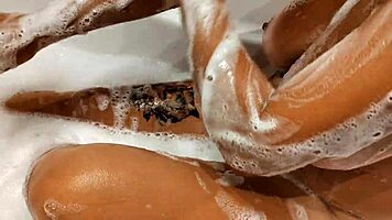 Tanned Big Tits Beauty Teases Pussy in Bathroom