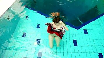 hairy brunette marketa swims underwater in tight pool
