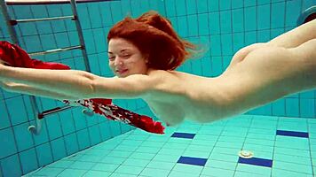 hairy brunette marketa swims underwater in tight pool