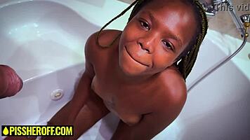 Petite ebony teen deepthroats sloppy in shower piss