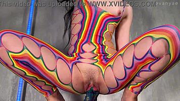 plunging huge alien dildo deep into wet pussy while in rainbow body stockings