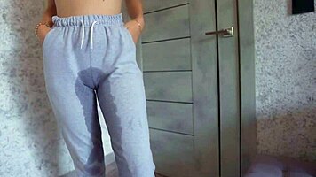 desperate pee drenches sweatpants in kinky thrill