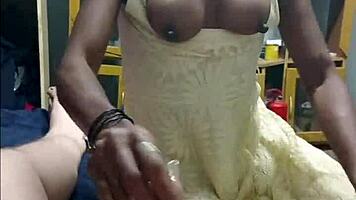 black beauty sucks white cock deep then squeezes it between perfect big tits