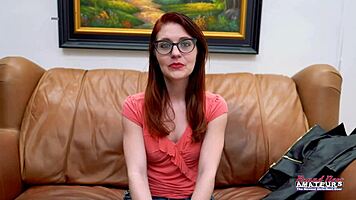 Nerdy redhead Dezi Rae fingers pussy wildly then deepthroats juicy cock