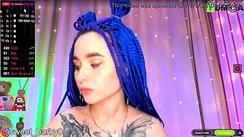 horny blue-haired babe teases tits and ass on cam 😈