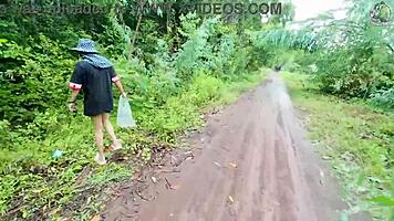 Thai babe hikes skirt flashing shaved pussy outdoors in garden