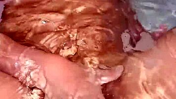 Latina babe fingers herself sensually to explosive bath orgasm