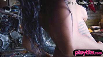 busty ebony model strips garage teasing huge tits