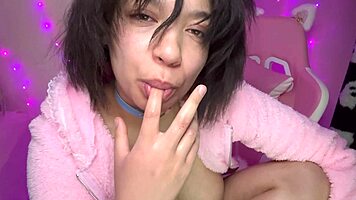 cheerleader teases with playful squirting for camera fun