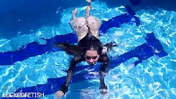 Latex Jessica Bunny poses seductively underwater