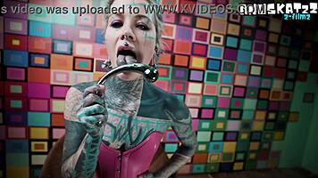 Pink corset tempts with steel toy anal and wand squirt tease