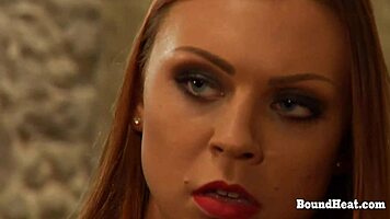 Leather mistress whips bound lesbian slaves into submission