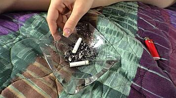 sadie kenney lounges smoking while fingering her shaved pussy in solo natural tits tease