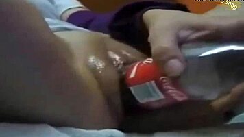 Watch This Hot Teen Shove Cola Bottle Deep for Wild Masturbation Climax!