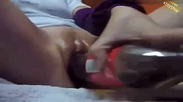 Watch This Hot Teen Shove Cola Bottle Deep for Wild Masturbation Climax!