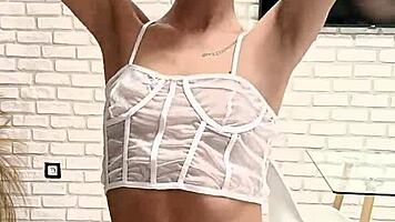 Petite brunette showcases small tits and narrow ass in short gym training routine