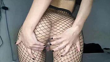Skinny tight girlfriend spreads juicy pussy lips in sexy fishnet tease