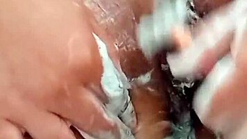 Young Brunette Spreads Hairy Pussy Close-Up Before Shaving It Smooth