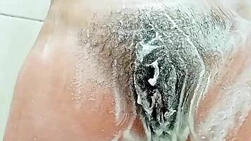 Young Brunette Spreads Hairy Pussy Close-Up Before Shaving It Smooth