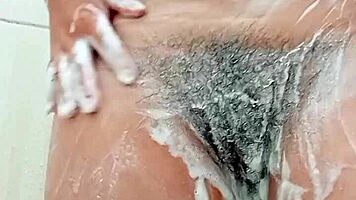 Young Brunette Spreads Hairy Pussy Close-Up Before Shaving It Smooth