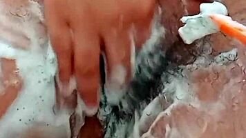 Young Brunette Spreads Hairy Pussy Close-Up Before Shaving It Smooth