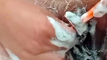 Young Brunette Spreads Hairy Pussy Close-Up Before Shaving It Smooth