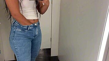 Skinny Brazilian teen fingers juicy swollen pussy lips flashing in shopping mall changing room