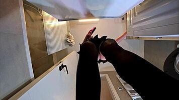 alicia poses in plaid skirt and stockings bathroom