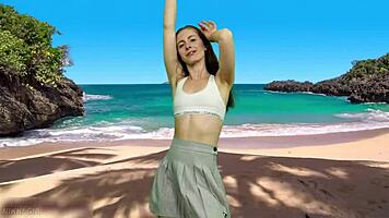 playful beach dancer teases with no panties flashing her curvy tight pussy lips