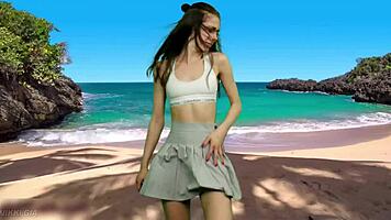 playful beach dancer teases with no panties flashing her curvy tight pussy lips