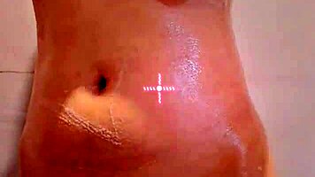 her sensual curves tease beneath shimmering wet skin