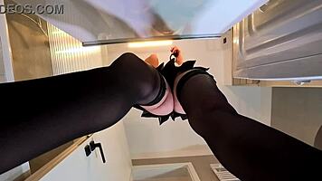 alicia poses in plaid skirt and stockings bathroom